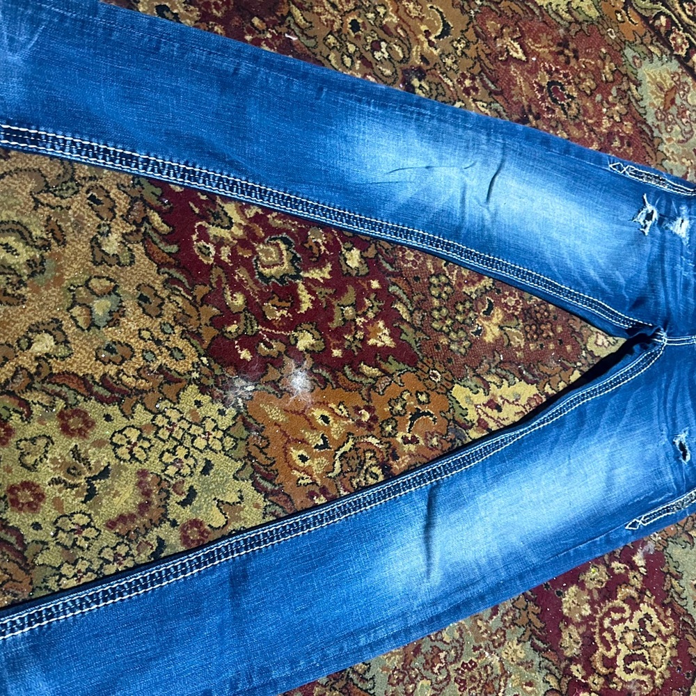 27. Straight leg rock revival jeans for women.